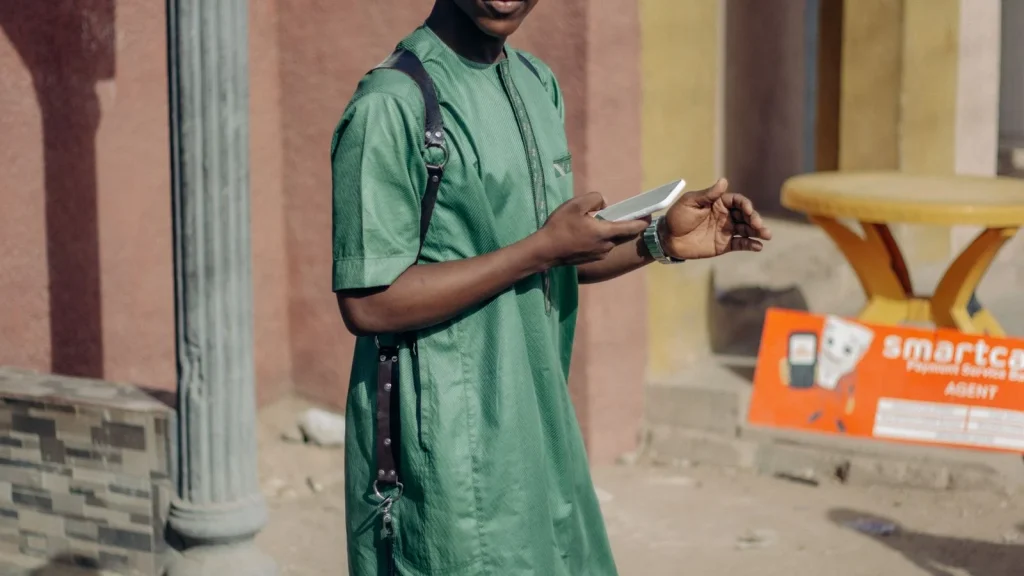 Person wearing colourful traditional African fashion on a city street